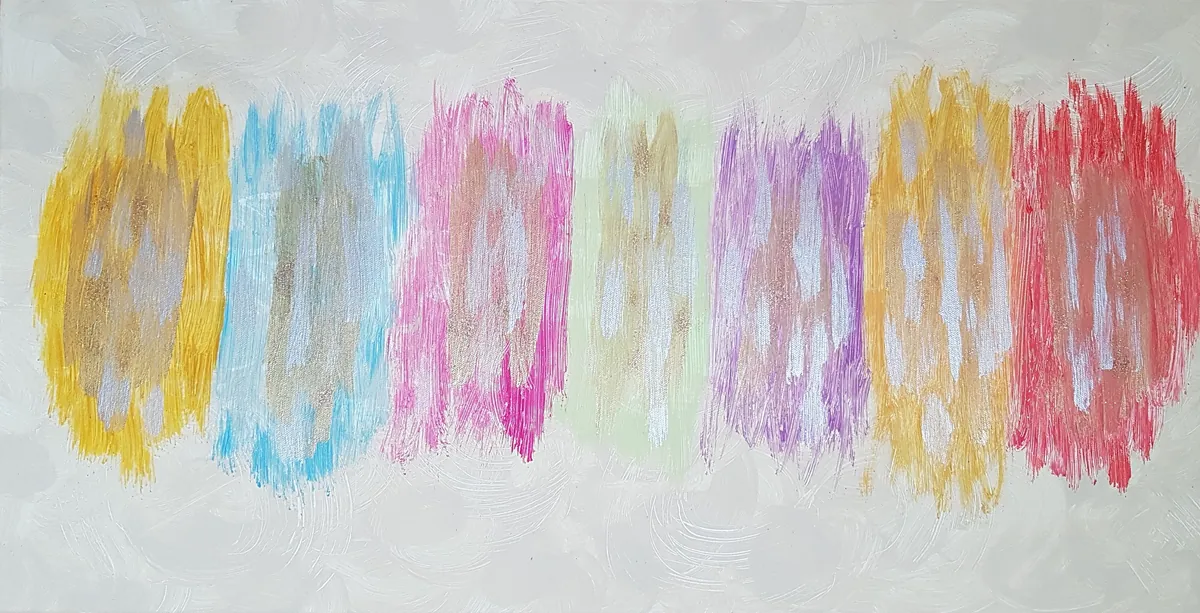 Farbstreifen in Gelb, Blau, Pink und Rot auf Papier